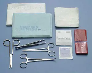 A surgical kit with scissors, bandages and other items.