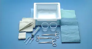 A surgical kit with scissors and a box.