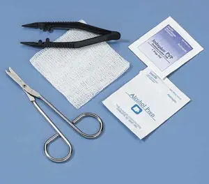 A medical kit with a pair of scissors and a bandage.