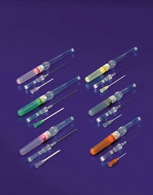 A group of plastic syringes on a purple background.