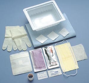 A surgical kit with gloves, gloves, and other items.