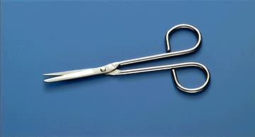 A pair of scissors on a blue surface.