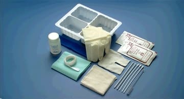 A medical kit with various items on a blue background.