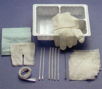 A plastic container with a glove, gloves, and other medical supplies.