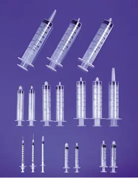 Syringes, needles and syringes on a purple background.