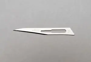 A small knife on a gray surface.