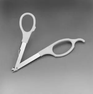 A pair of scissors on a gray background.