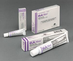 Four tubes of elamax on a grey surface.