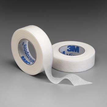 Two rolls of 3m medical tape on a grey background.