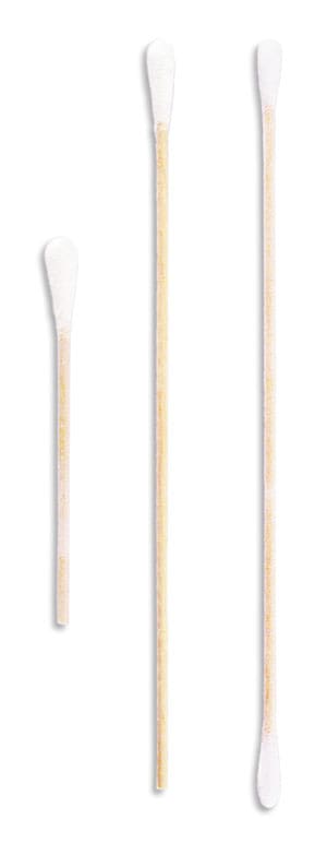 Three wooden brooms on a white surface.