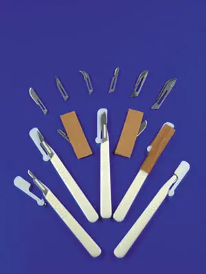 A set of plastic tweezers on a blue background.