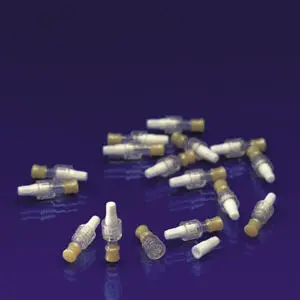 A group of plastic syringes on a purple surface.