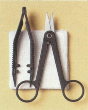 A pair of scissors on a yellow background.