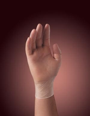 A person's hand on a red background.