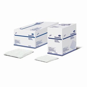 Two boxes of surgical pads on a white background.