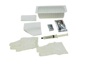 A white tray with some pieces of paper and a tube