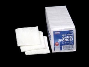 A box of guzzle sponges on a black background.