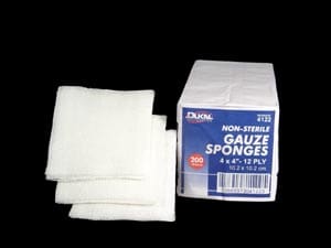 A pack of white sponges on a black background.