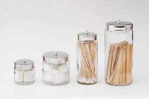 Glass jars with cotton swabs and toothpicks.