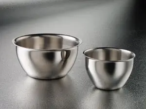 Two stainless steel bowls on a table.