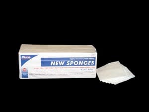 A box of new sponges on a black background.