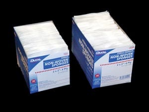 Two boxes of white tissue paper on a black background.