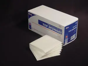 A box of white top sanitizing wipes on a black surface.