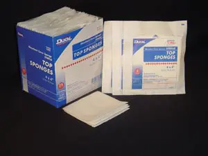 A pack of surgical pads and a box of sterile wipes.