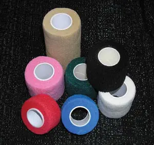 A variety of different colored bandages on a black background.