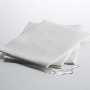 A white cloth sitting on top of a white surface.