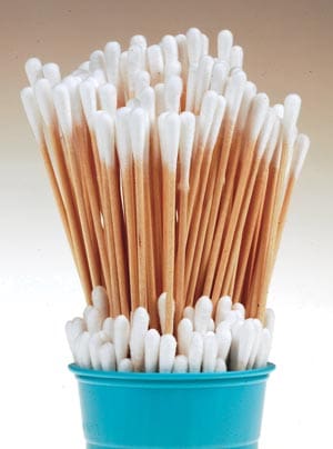 White cotton swabs in a blue cup.