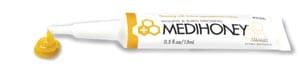 A tube of med honey on a white background.