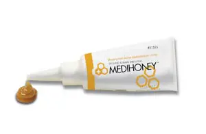 A tube of med honey on a white background.