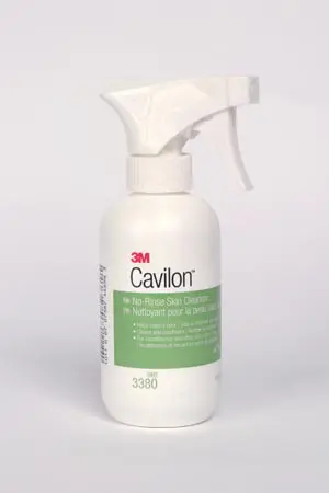 A bottle of cavilon spray on a white background.