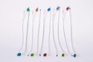 A group of toothbrushes lined up on top of each other.