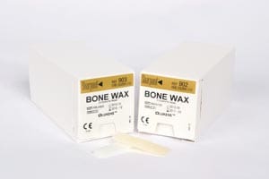 Two boxes of bone wax on a white background.