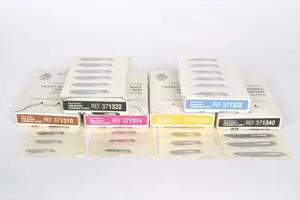 A group of boxes with different types of tweezers.