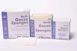 Four boxes of gauze sponges on a white background.