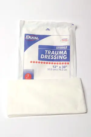 A package of training dressings on a white surface.