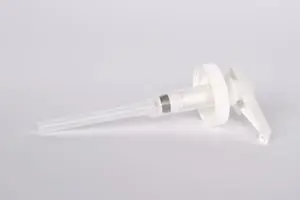 A white plastic syringe on a white background.