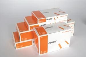 A stack of orange and white boxes on a white surface.