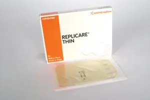 A package of replicare thin on a white surface.