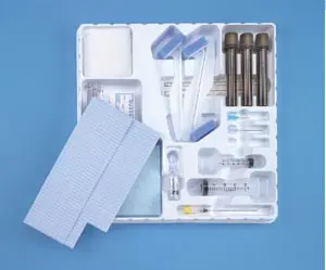 A white tray with medical supplies in it.