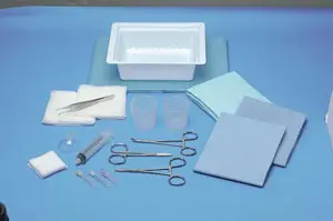 A surgical kit with various tools and supplies on a blue background.