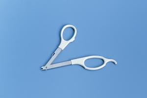 A pair of scissors on a blue background.