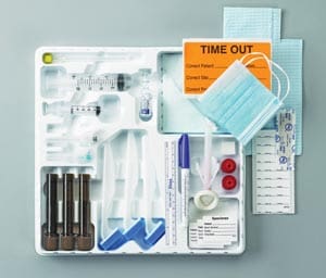 A plastic tray with medical supplies on it.