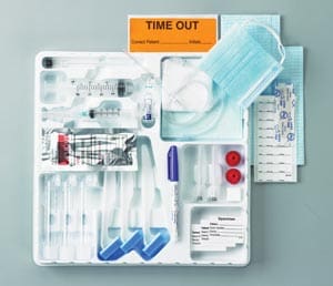 A plastic tray with medical supplies in it.