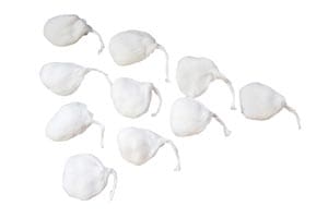 A group of white cotton balls on a white surface.