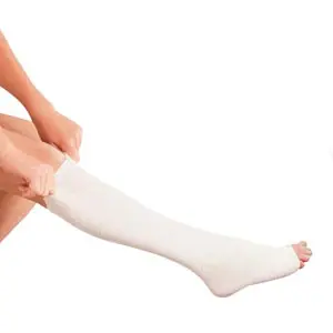 A woman wearing a white compression sock on her leg.