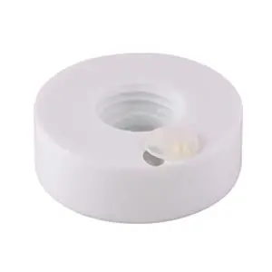 A white plastic nut on a white background.